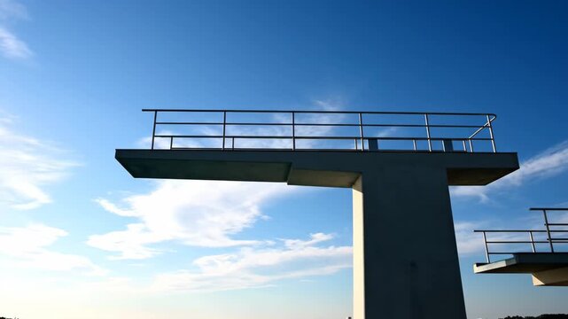 Video of empty high dive platform silhouette against clear sky, modern design and spatial minimalism theme.