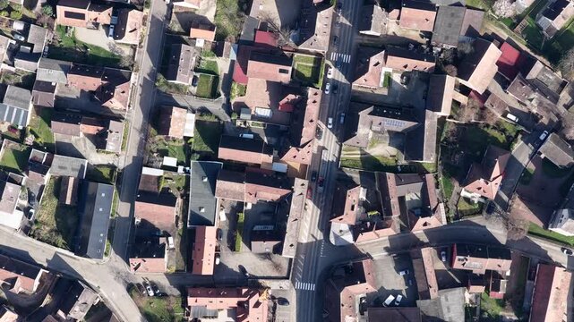 Aerial view of rooftops and roads creating intricate patterns, highlighting the dense urban layout of Mittelwihr, Grand Est, France.