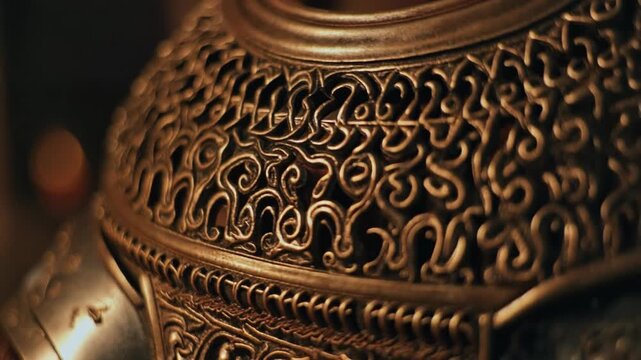 Extreme detail of medieval armor patterns illuminated by candlelight
