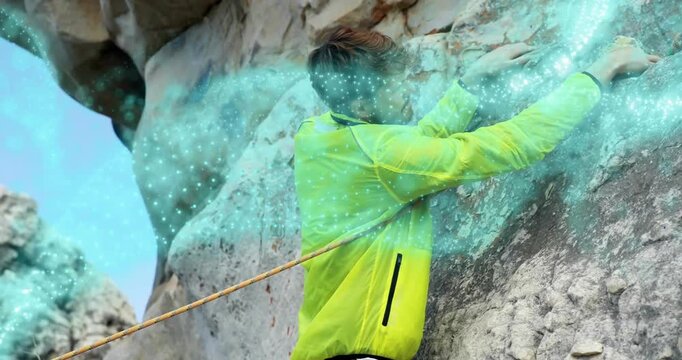 Male climber securing rope then clipping quickdraws with pulsing AR technology overlay for safety