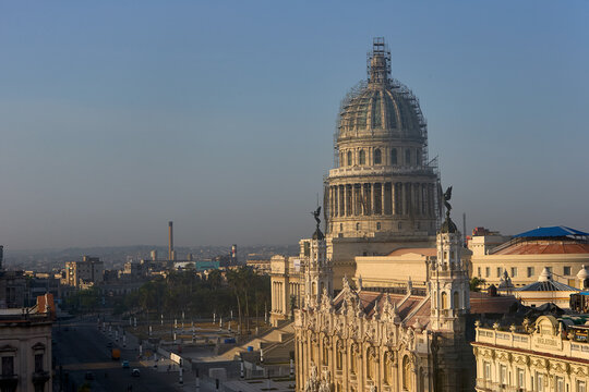 Morning light illuminates the historic skyline of Old Havana,where the ornate fa&ccedil;ade of the Gran Teatro de La Habana stands beside the iconic dome of the El Capitolio, reflecting the rich architecture