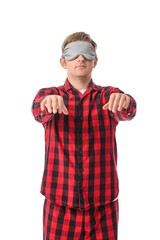 Male sleepwalker in pajamas on white background