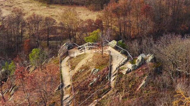 Aerial drone view of Sealsfield Stone (Sealsfieldův k&aacute;men) viewpoint overlooking vineyards and rolling countryside in Podyj&iacute; National Park near Znojmo, Czech Republic. Scenic landscape and hiking dest