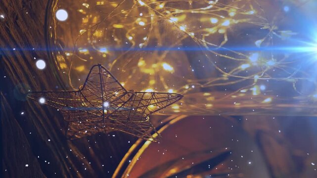 Animation of light trails and snowflakes over decorations at christmas