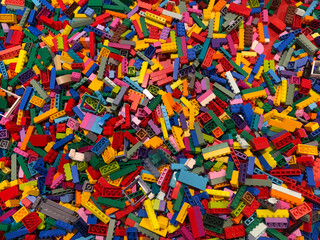 Naklejka premium Colorful pile of small interlocking bricks