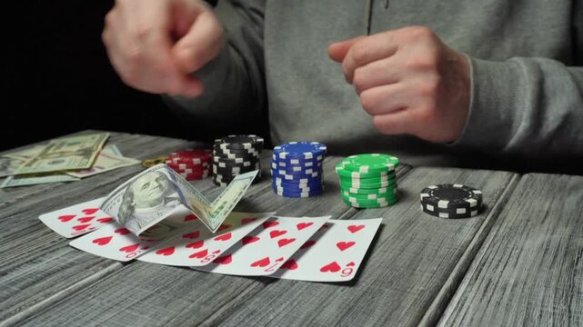 A man in a gray sweater plays poker and throws cash on a straight flush as a bet, creating a dynamic gambling atmosphere with colorful chips and playing cards