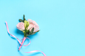 Beautiful boutonniere with ribbon on color background © Pixel-Shot