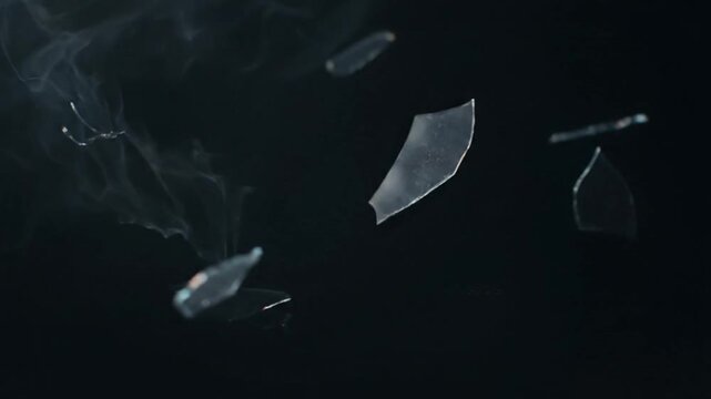 Shattered glass fragments flying isolated on transparent background