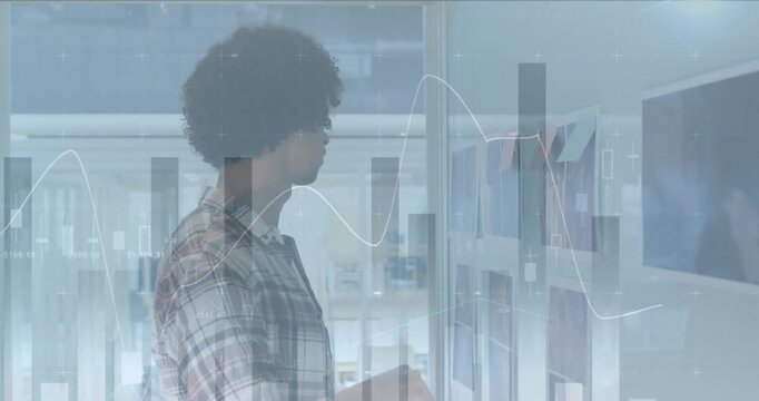 Animation of multiple graphs over man sticking notes on pictures in office
