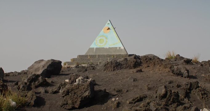Sun clock among the rocks at the foothills of Etna volcano, travel Sicily, 4k