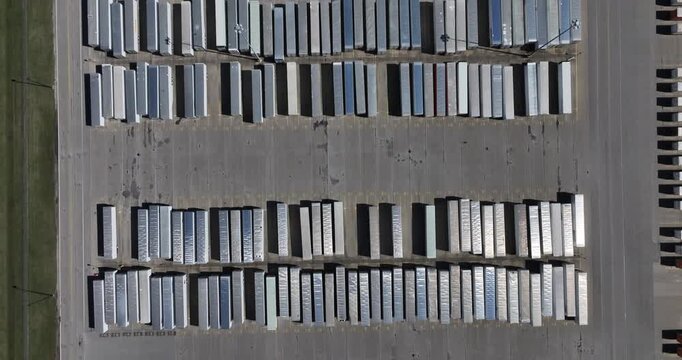 Aerial view of rows and rows of parked trailers creating a geometric pattern of silver and gray, Greensburg, Indiana, United States.