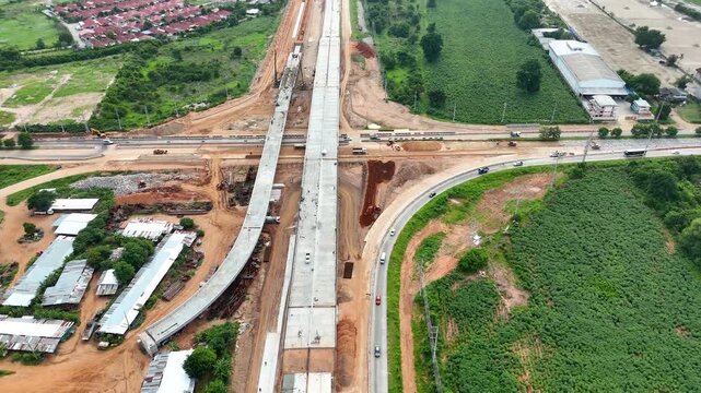 Drone footage a construction working tractor is refining the soil in preparation for laying asphalt The process of making a highway