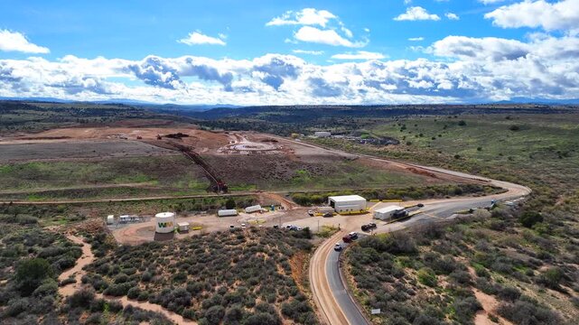 Aerial view of the WM - Gray Wolf Regional Landfill contrasting the barren earth with the surrounding vegetation, Dewey, Arizona, United States.