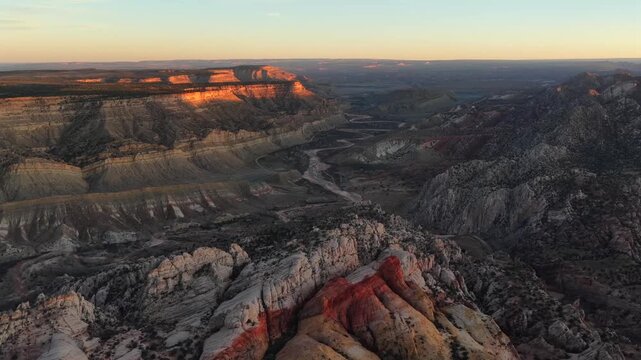 Aerial view of canyons with contrasting light and shadow patterns, creating a textured landscape, Escalante, Utah, United States.