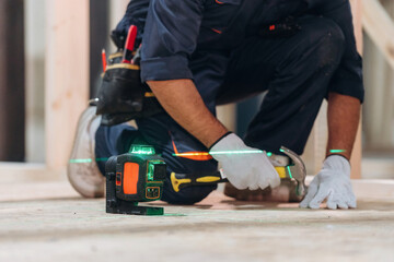 Close-up of a carpenter working with wood using professional tools in a workshop