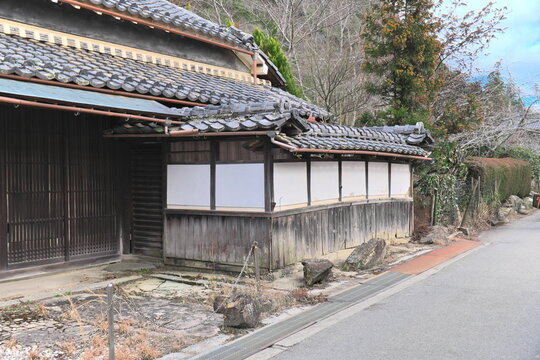 Traditional Japanese house with tiled roof and wooden walls