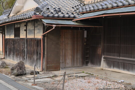 Traditional Japanese house with tiled roof and wooden walls