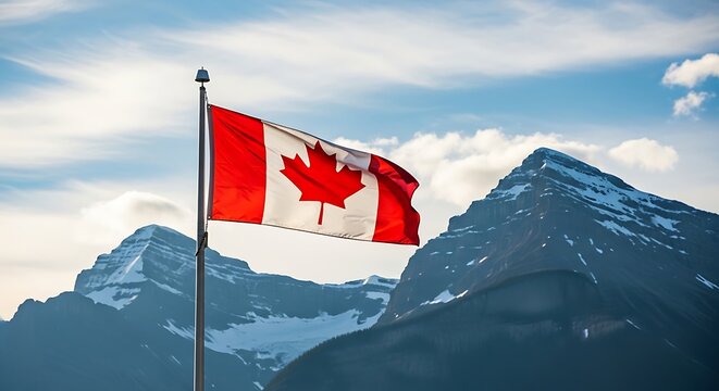 Canadian flag waving in front of snowy mountains