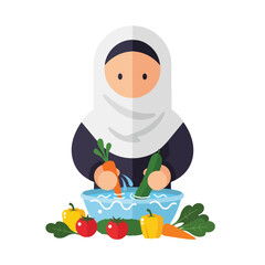Obraz premium Woman in headscarf washing vegetables in a bowl of water