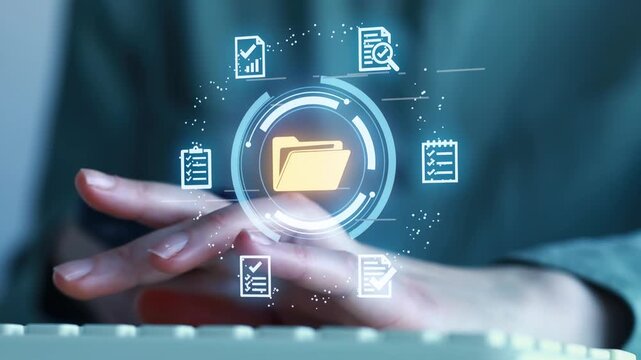 Person using a smartphone while interacting with digital file icons on a screen inside an office setting during daytime.