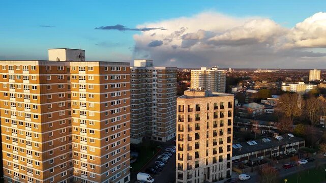 A close up aerial clip of a drone flying in between high rise apartment blocks in London. UK.