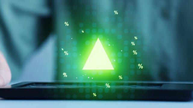 Light green triangle appears above tablet screen during digital display or interactive design session in indoor setting.