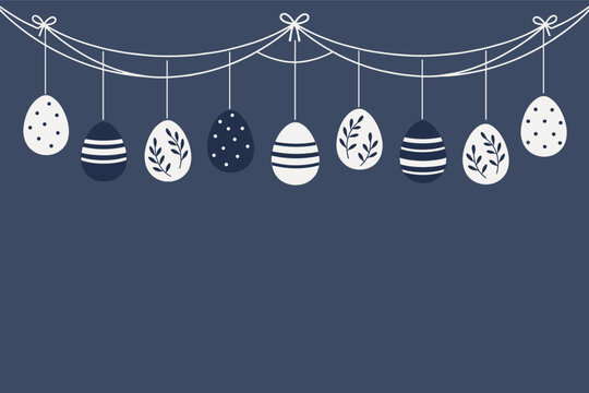 Hanging decorated easter eggs on dark blue background