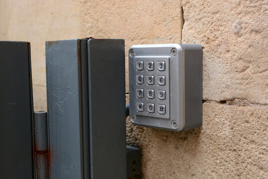 
a box on the wall with buttons and numbers for entering a code to enter the apartment