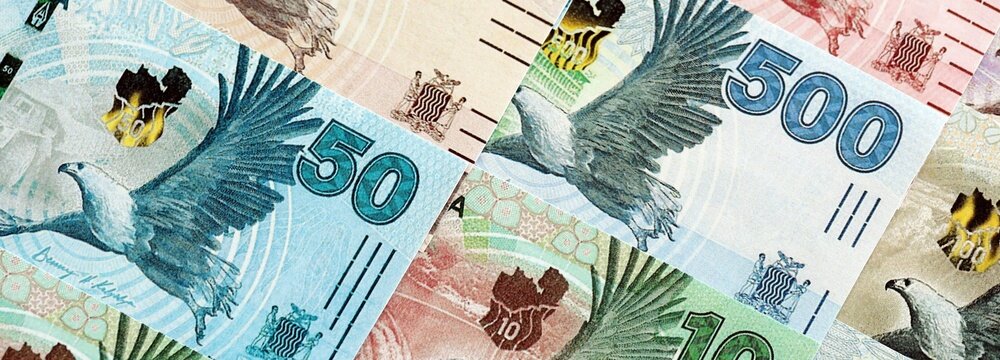 Zambian kwacha money bills pile on table. Zambia banknotes of ZMW currency close up. Concept of business, economy and banking in Zambia