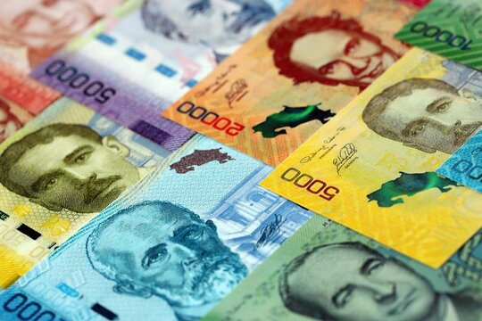 Costa Rican old and new colon money bills pile on table. Costa Rica banknotes of CRC currency close up. Concept of business, economy and banking in Costa Rica