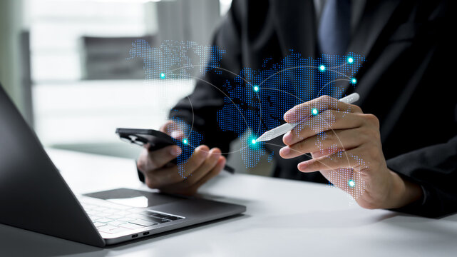 Businessman interacting with a global communication network over a world map, representing international business connections, digital communication, and worldwide corporate collaboration.