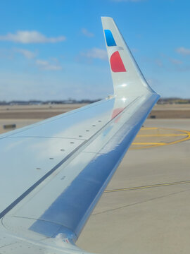 Window view of the wing, engine, and winglet of an American Airlines airplane (Minneapolis, USA - March 13, 2026). For Editorial Use Only.