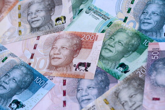 South African rand paper banknotes pile on table. South Africa ZAR currency money bills in big amount. Concept of economics, taxation and banking in South Africa