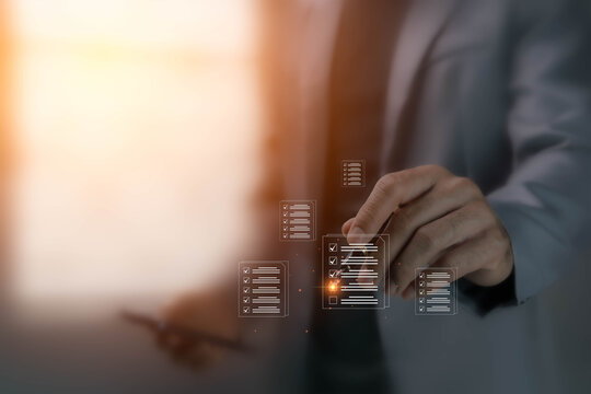 The checklist concept involves reviewing documents on an electronic system, a paperless workflow, and a structured process of ticking checkboxes. (Image on the left side with an orange light tone.)