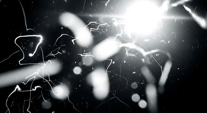 White lightning bolts and bright light on black background