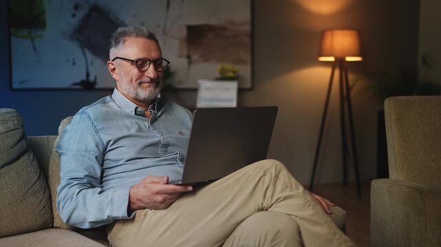 Friendly male counselor giving video consultation on laptop, psychological help