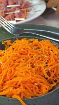 Strips of carrots marinate in a mixture of vinegar, garlic, and cayenne, which adds tang and just a small kick of spice.