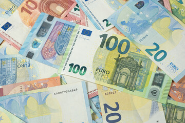Obraz premium Pile of Euro banknotes of different denominations top view.