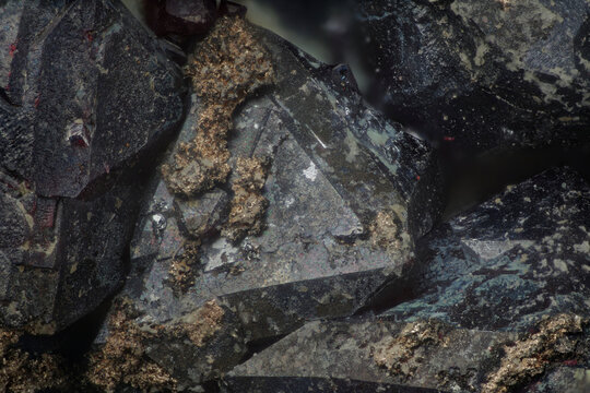 Macro image of cuprite dark red octahedral crystals with native silver inclusions from Rubtsovskoye, Altai, Russia, at 9&times; magnification (4 mm field of view)