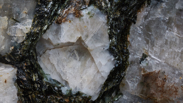 Macro image of albite and aegirine crystals showing pegmatite crystallization hydrothermal activity. Microscope objective at 4x magnification with 9mm view