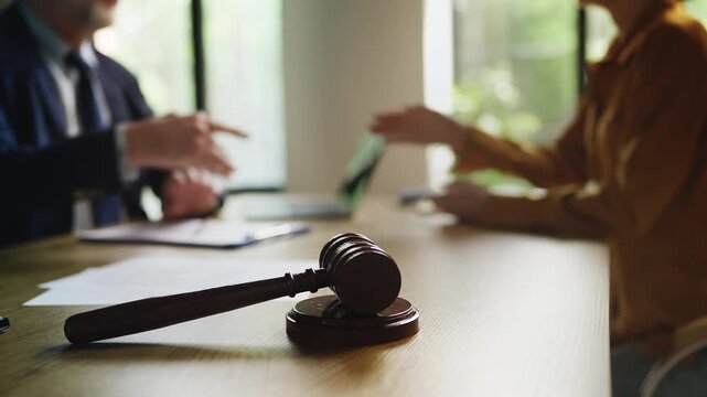 Attorney and woman client confirming partnership with handshake, justice system