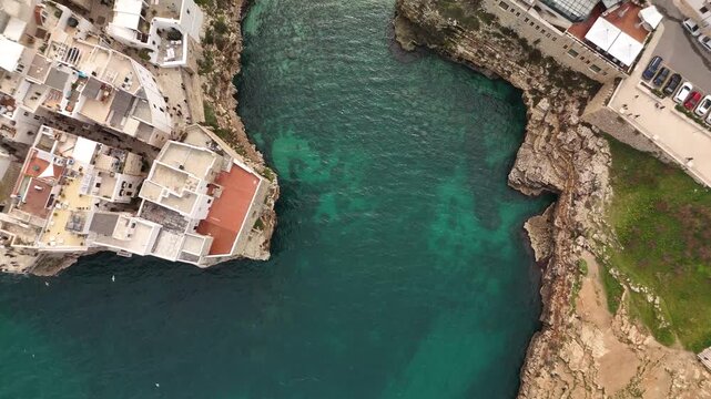 Aerial View of Polignano a Mare with Historic Buildings and Crowded Beach, Puglia, Southern Italy