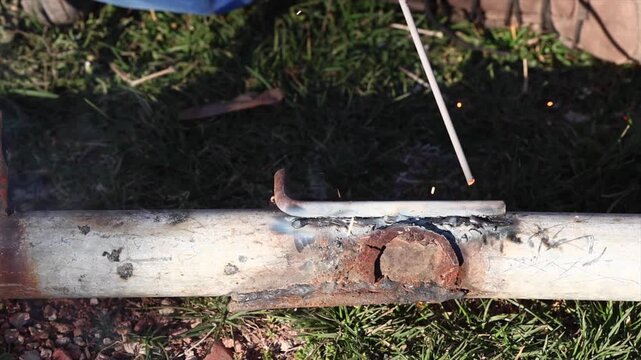 Welding process with bright sparks and smoke
