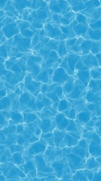 Water waves move in a pool during sunny daytime, creating patterns on the surface as light reflects off the blue water