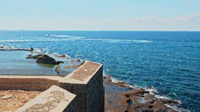 Akko old city coastal wall overlooking mediterranean sea