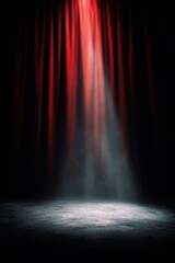 Obraz premium The stage is empty with a single bright light shining down onto the floor. Red curtains hang on the sides, and shadows surround the area. It is a moment before the performance starts