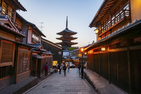 Yasaka dori historic street in the old town with traditional Japanese houses, five-story Yasaka Pagoda of the Buddhist Hōkanji Temple at the back, evening mood, blue hour, Higashiyama, Kyoto, Japan