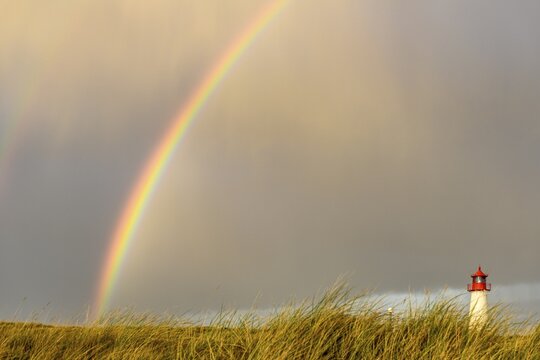Lighthouse List-ost, in dune landscape with rainbow, Ellenbogen, List, island Sylt, Germany
