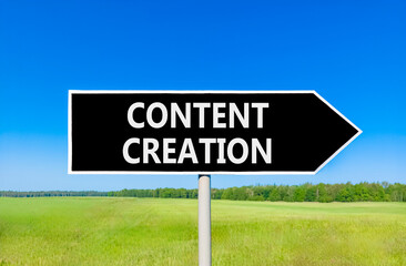 Time for content creation symbol. Concept words Content creation on beautiful black road sign. Beautiful blue sky green grass field background. Business time for content creation concept. Copy space.