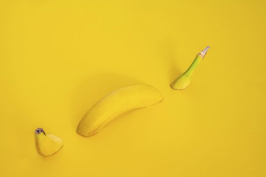 Sliced banana on a yellow background